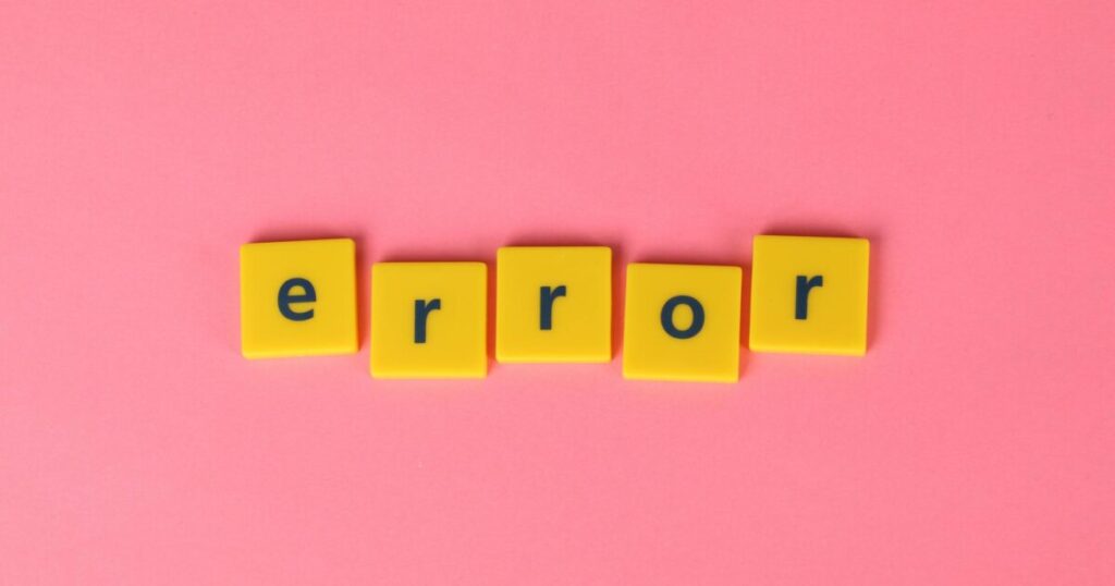 Yellow block letters spelling 'error' on a vibrant pink background, capturing a playful message.