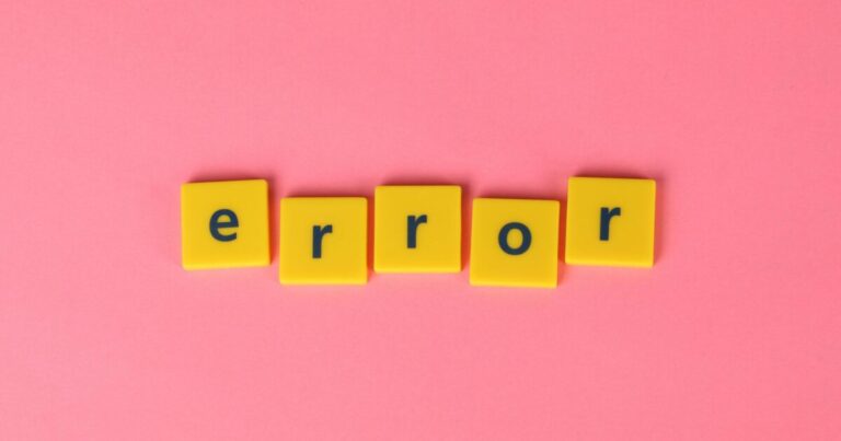 Yellow block letters spelling 'error' on a vibrant pink background, capturing a playful message.