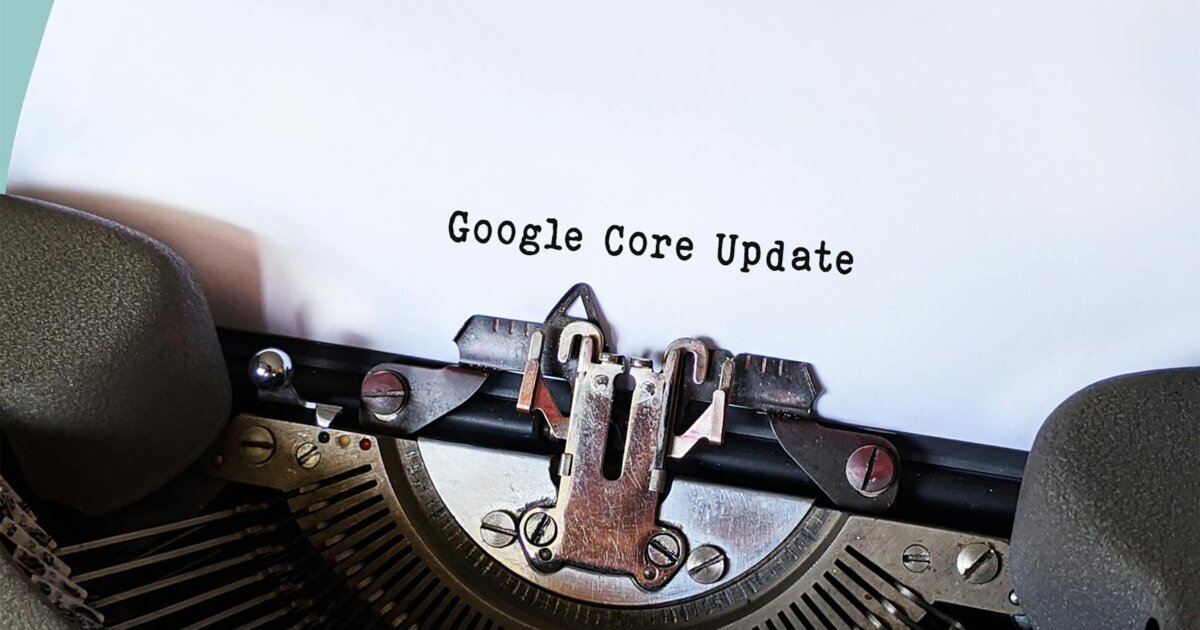 Close-up of a typewriter typing 'Google Core Update' on paper, symbolizing digital advancement.