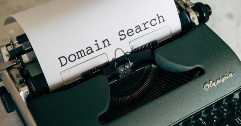 Close-up of a vintage typewriter with paper displaying 'Domain Search' text for conceptual design.