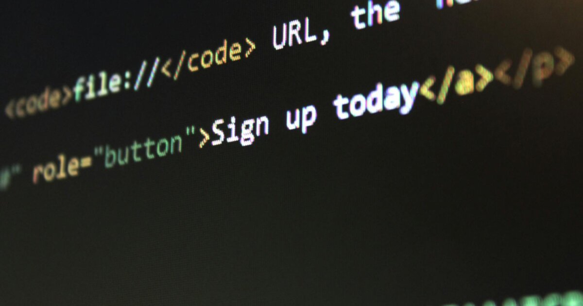 Detailed view of HTML and CSS code on a computer screen, concept of programming.