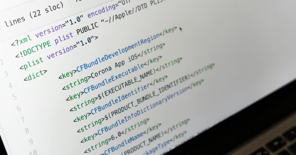 Detailed view of XML coding on a computer screen, showcasing software development.